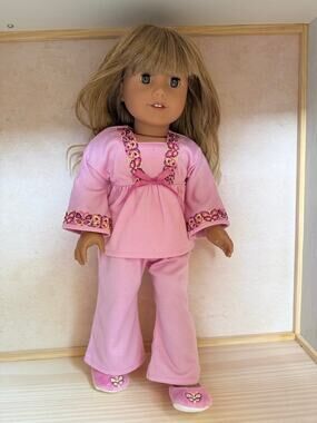 American Girl doll with custom wig in Julie’s pajamas with slippers